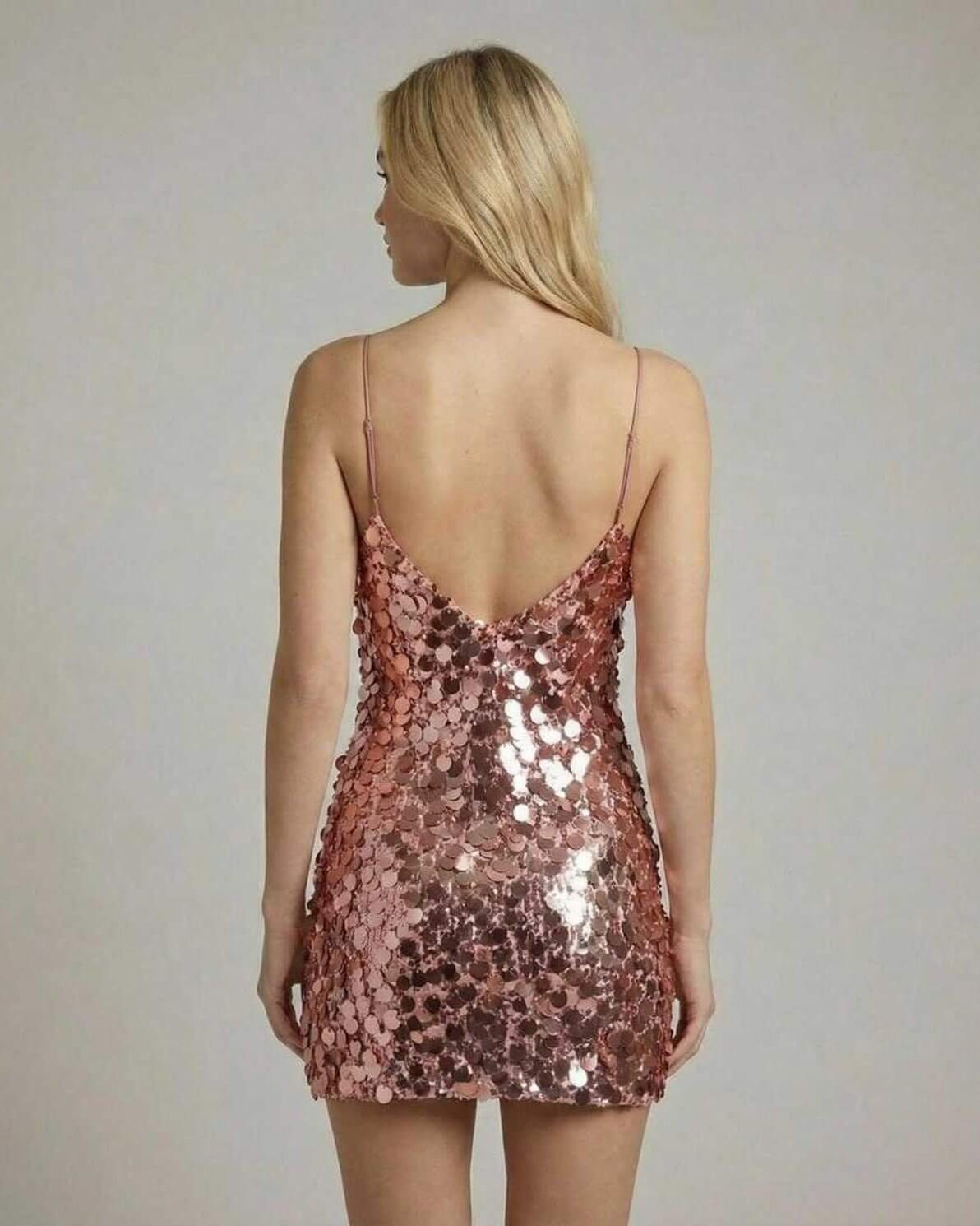 Back view of Xima Mini Dress by RAMBLION, a rose gold sequin mini dress perfect for evening elegance.
