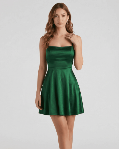Xoma Mini Dress in rich emerald green satin, featuring a round neck and A-line silhouette by RAMBLION, perfect for evening wear.