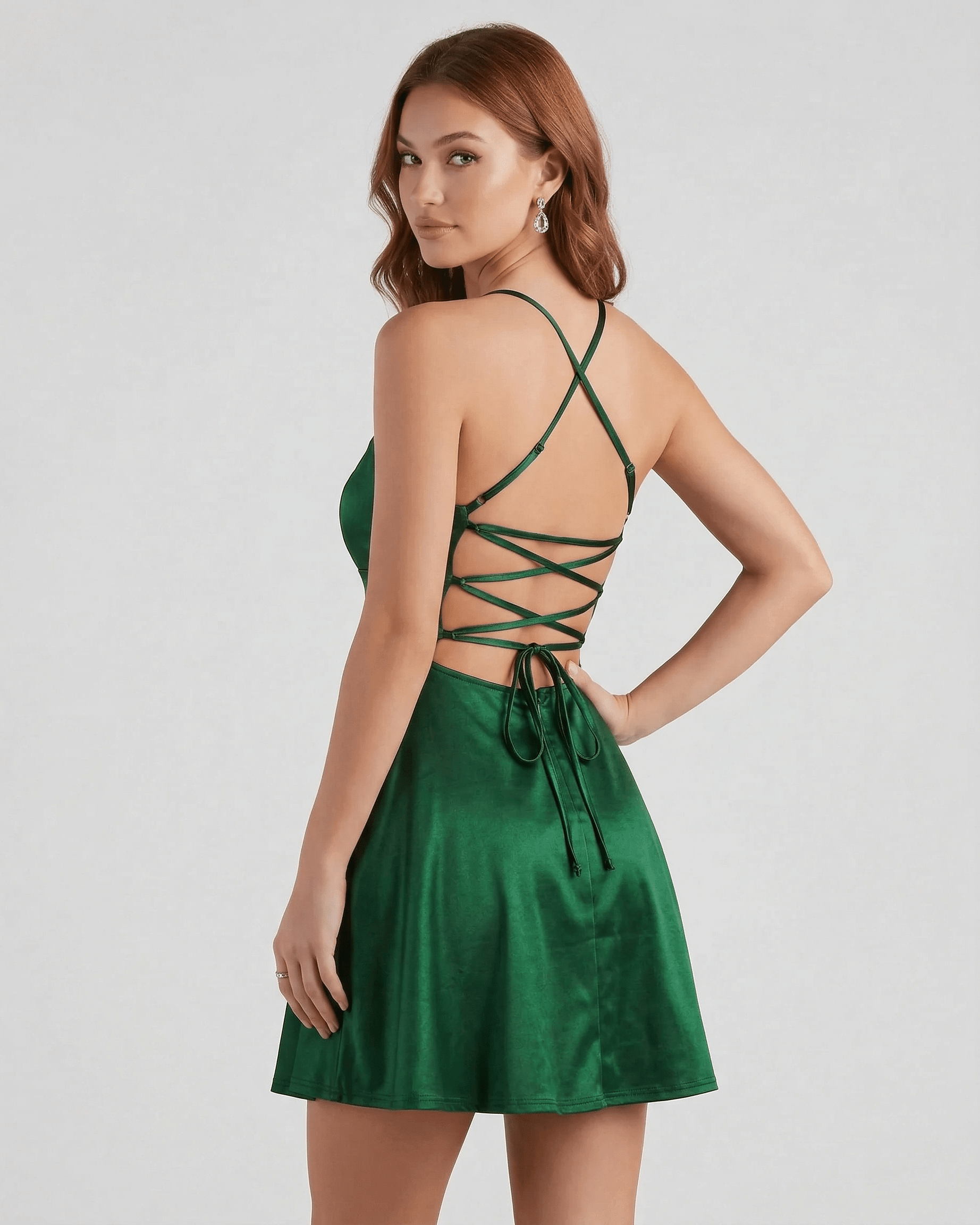 Xoma Mini Dress featuring a rich emerald green hue and spaghetti straps, perfect for evening occasions by RAMBLION.