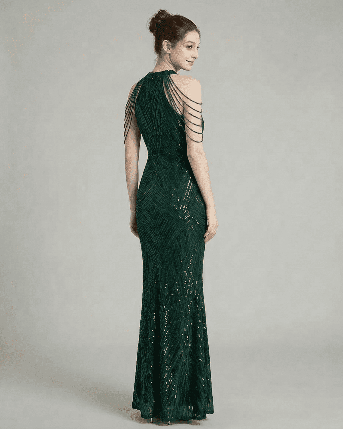 Yafe Maxi Dress featuring a halter neckline, beaded details, and sequin embellishments in emerald green, ideal for elegant occasions.