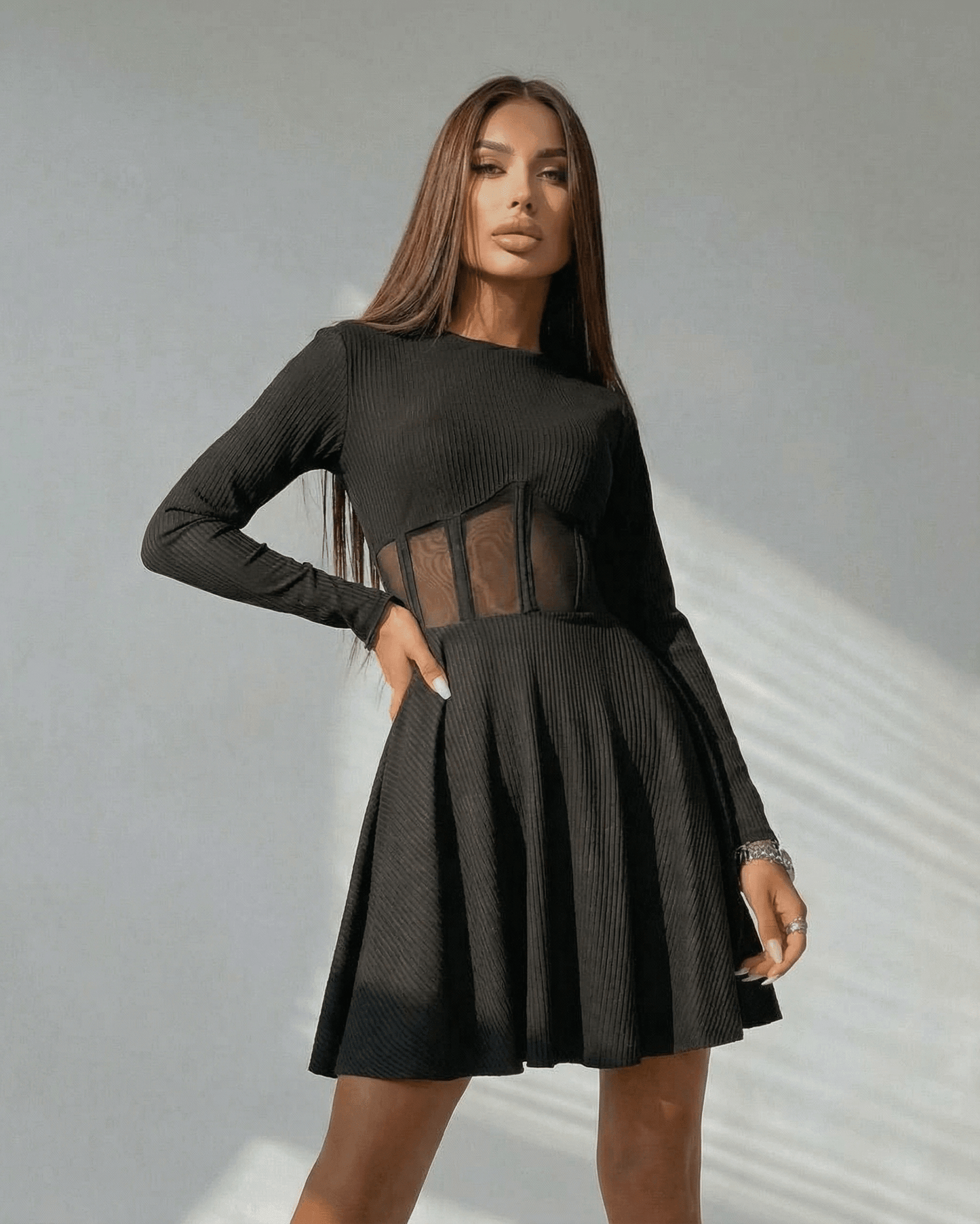 Yera Mini Dress featuring black A-line design, sheer corset panel, elegant style for casual occasions by RAMBLION