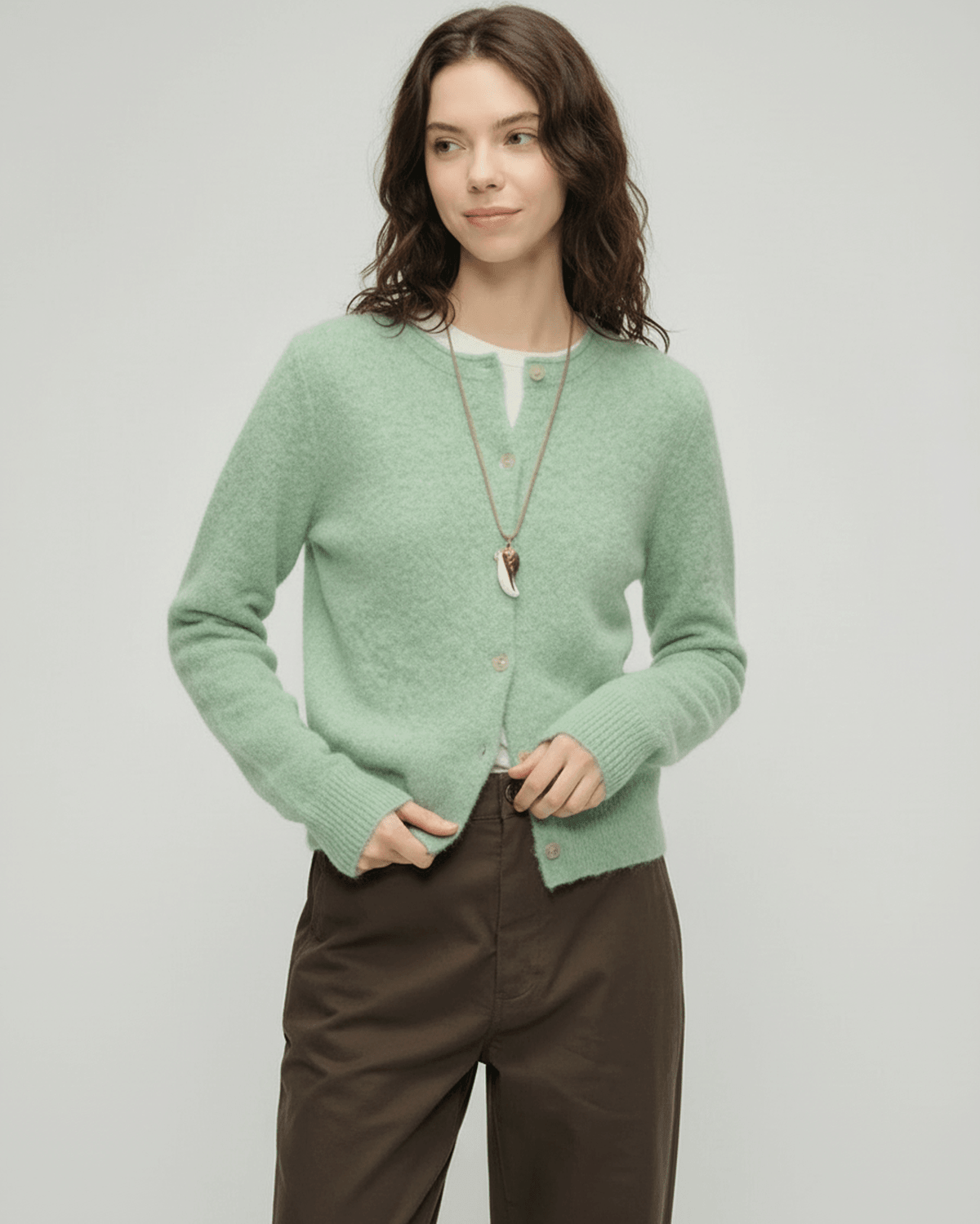 Yola Cardigan from RAMBLION in soft green hue, thick knit for warmth, perfect for layering, elevates everyday style.