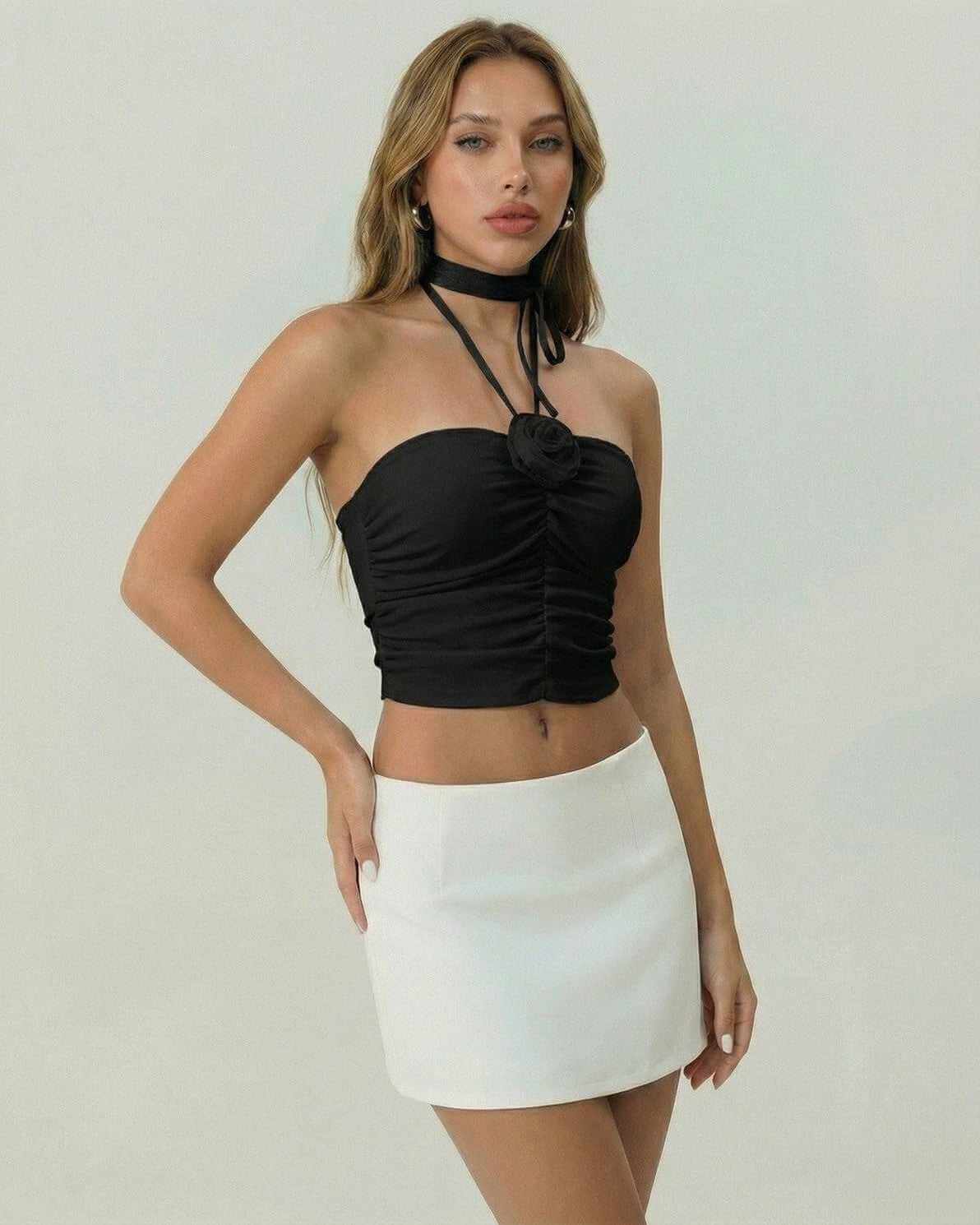Yola Top by RAMBLION, black halter mini dress, ruched detailing, perfect for casual outings and chic events.