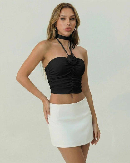 Yola Top by RAMBLION, black halter mini dress, ruched detailing, perfect for casual outings and chic events.
