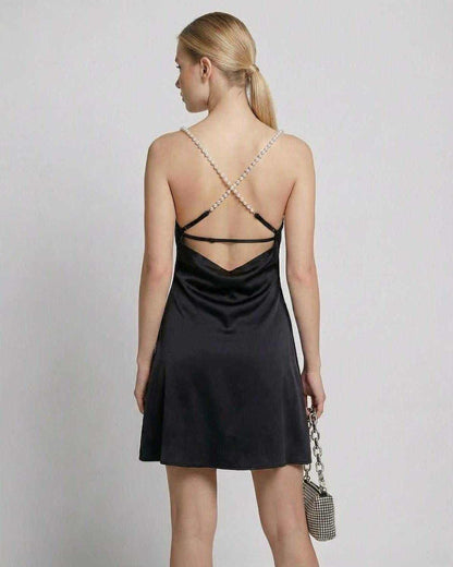 Zafo Mini Dress - Elegant black satin mini dress with a chic back design, perfect for evening occasions by RAMBLION.