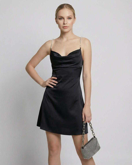 Zafo Mini Dress in elegant black satin, ideal for evening outings, featuring stylish straps and a chic silhouette, by RAMBLION.