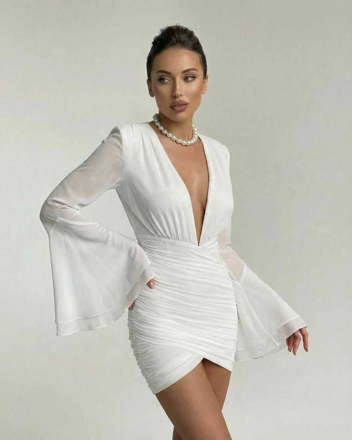 Zana Mini Dress in white, featuring a V-neck, flared sleeves, stylish silhouette, perfect for elegant occasions by RAMBLION.