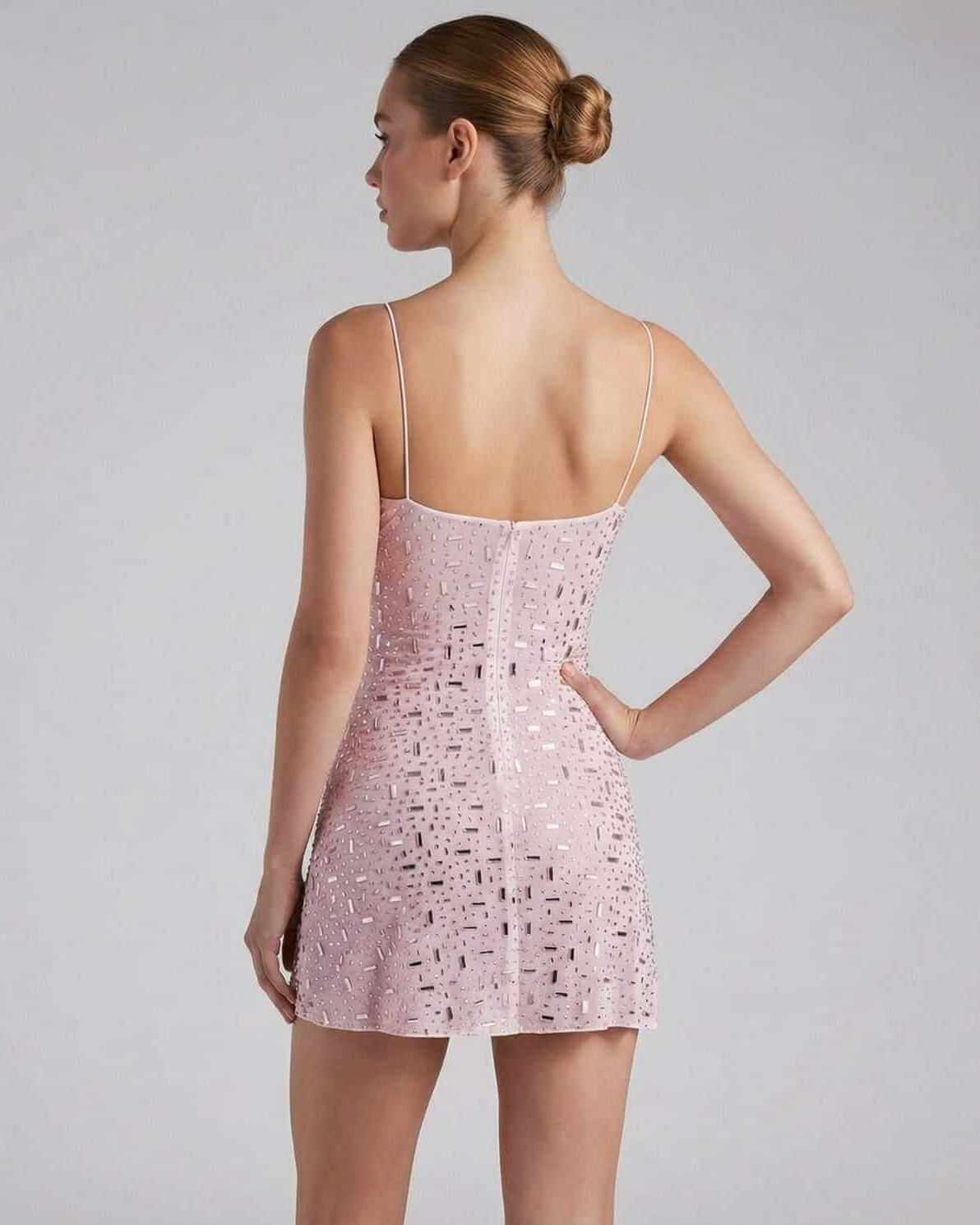 Zia Mini Dress showcasing a stylish pink design with elegant rhinestone details, perfect for chic occasions by RAMBLION.