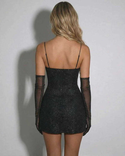 Zola Mini Dress: Back view of a black mini dress with sequin overlay, V-neck design, perfect for chic occasions. By RAMBLION.