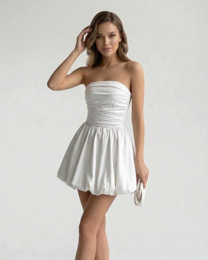 Zoya Mini Dress - Strapless white satin mini dress with ruched bodice, perfect for elegant occasions by RAMBLION.